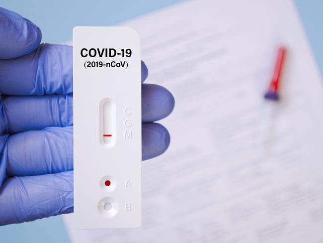 Positive test result by using rapid test for COVID-19, quick fast antibody point of care testing.